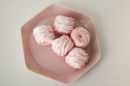 a plate of strawberry marshmallowsの写真素材