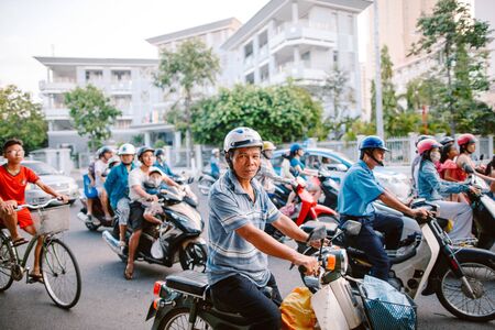 Vietnam. Nha Trang May 24, 2015. Residents of Nha Trang are standing in a motorbikeのeditorial素材