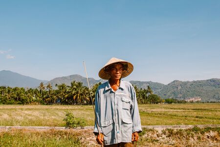 Vietnam. Nha Trang May 24, 2015. Vietnamese farmer in the fieldのeditorial素材