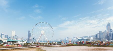 China Hong Kong 2016 December 31. Panoramic view of the ferris wheel and skyscrapersのeditorial素材