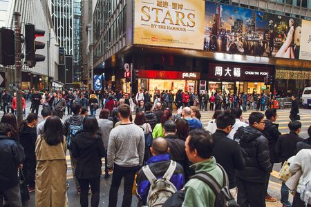 China Hong Kong 2016 December 31. A crowd crossing a street in the center.のeditorial素材
