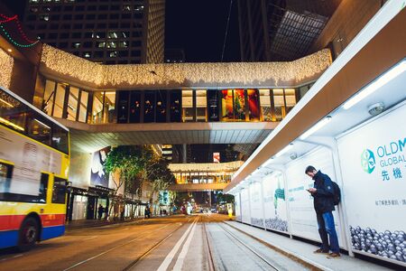 China Hong Kong 2016 December 31. Man at the tram stop.のeditorial素材