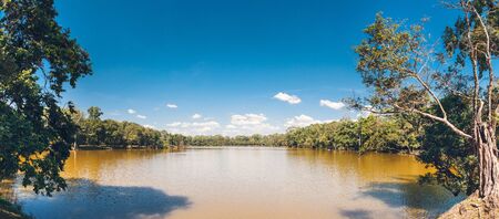 Water moat surrounding Angkor Wat Temple. Sangkat Nokor Tum Siem Reap, Cambodiaの写真素材