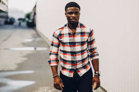 Black guy in shirt posing on white backgroundの写真素材