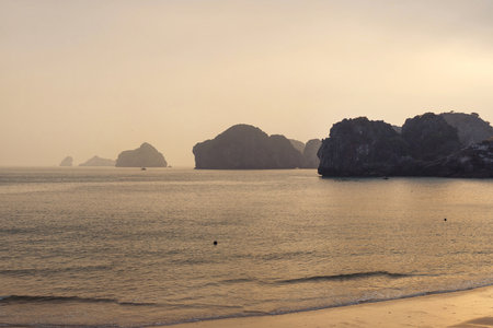 Sunset view on rock islands and sea in Ha Long Bay. Cat Ba, Vietnam.の写真素材