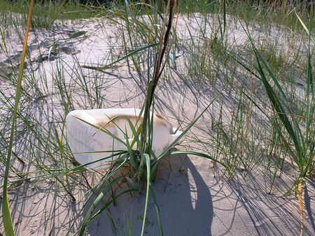 Plastic on the beach. Environmet impact, climate change.の写真素材