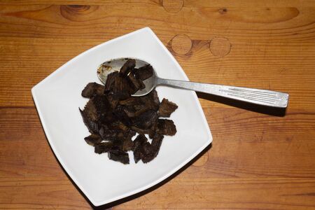 Pieces of burnt meat on a plate. Inedible food. Wooden rustic backgroud.
Homemade food. Top view, background. Rusticの写真素材
