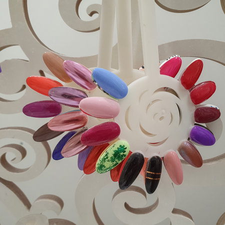 Collection of samples of varnish for manicure. Nails art design samples. Collection of finger nails painted in various color with different pattern. Nail art design concept. Beauty industryの写真素材