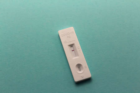 Negative SARS-CoV-2 Rapid Antigen Test on aqua blue background, horizontal copy spaceの写真素材
