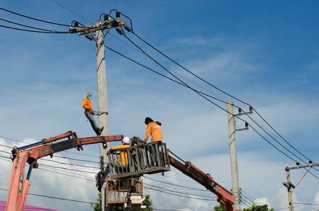 Electrician repair of electric power system on hydraulic platformのeditorial素材
