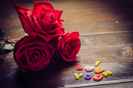 words of I love you  roses on wooden backgroundの写真素材