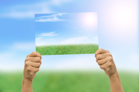 Human hands holding pictureの写真素材