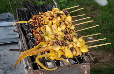 The squid grilled over charcoal fireの写真素材