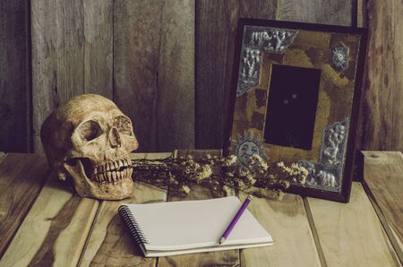 Still life picture frames vases dried rose notebook concept frequent memoriesの写真素材