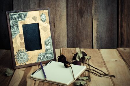 Stock Photo: Still life picture frames vases dried rose notebook concept frequent memoriesの写真素材