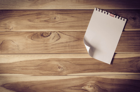 The white paper notes on the wooden floorの写真素材