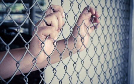 Hands and Steel Cageの写真素材