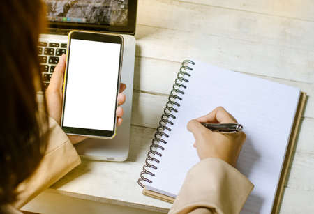 working with notebook in the officeの写真素材