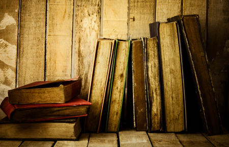 Old books on the wooden background.の写真素材