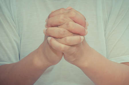 Body language of man - Pray for God's blessing Crossの写真素材