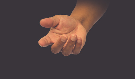 open hand on black backgroundの写真素材