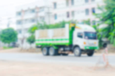 Blur six-wheel dump trucks, road construction work.の写真素材