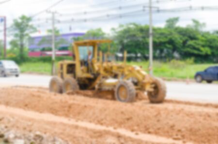Blurred image motor grader, road construction workの写真素材
