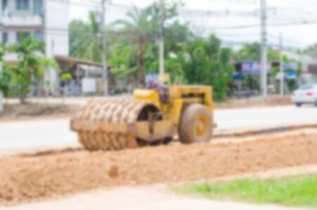 Blurred image motor grader, road construction work