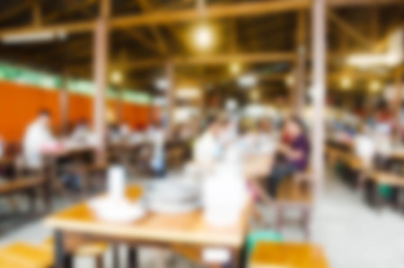 Blur restaurant with customers to access services.の写真素材