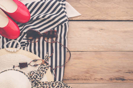 Clothing and accessories for women on wood floorの写真素材