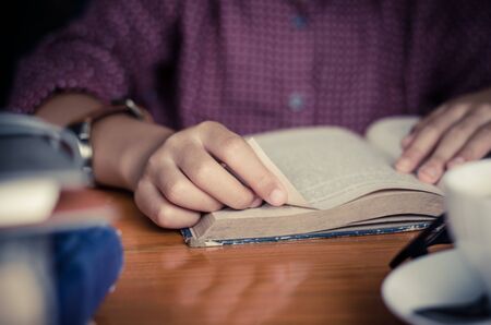 Focus hand open book for reading concept background
