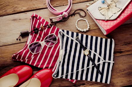 Clothing and accessories for women on wood floorの写真素材