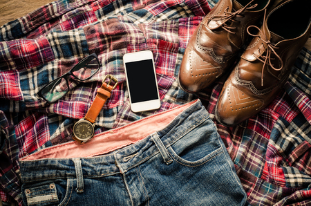 costume and accessories for men, placed on a wooden floor.の写真素材