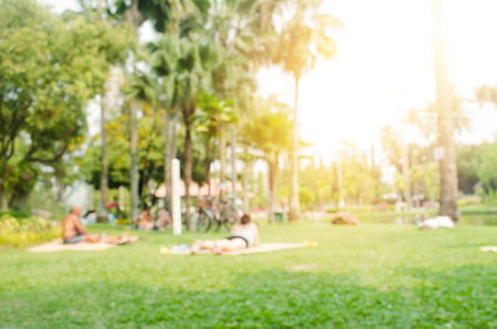 Blur people activities in the public park in morningの写真素材