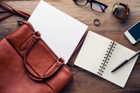briefcase and document on wooden floorの写真素材