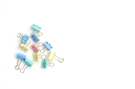 Colored paper clips on a white background.の写真素材