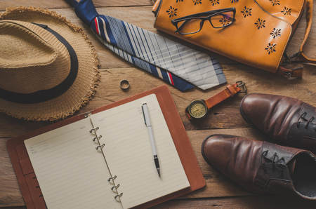 Tourism planning and equipment needed for the trip on wooden floorの写真素材