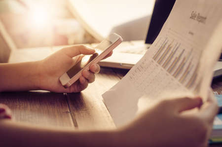 Closeup business working with for smart phoneの写真素材