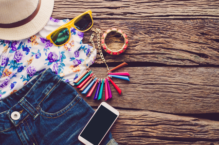 Travel Clothing accessories Apparel along on wooden floorの写真素材