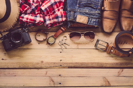 Travel Clothing accessories Apparel along on wooden floorの写真素材
