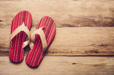 Red slipper on woodenの写真素材