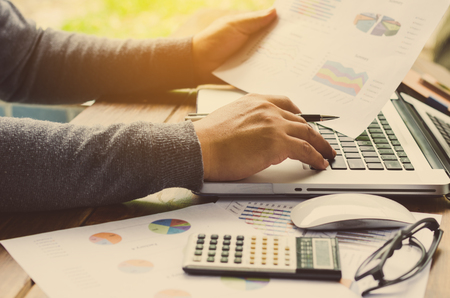 Working on a desk numerical analysis, financial accounting. Graphingの写真素材