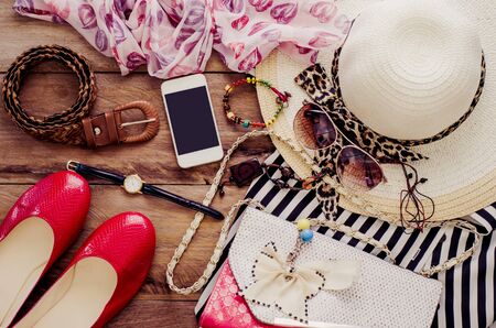 Clothing and accessories for women on wood floorの写真素材