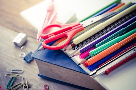 School supplie placed on a wood background concept ready for school.の写真素材