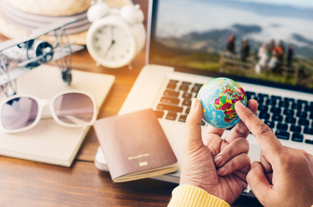 Travelers point to world are planning a trip for the holidays on laptop background - concept prepare to travel
の写真素材