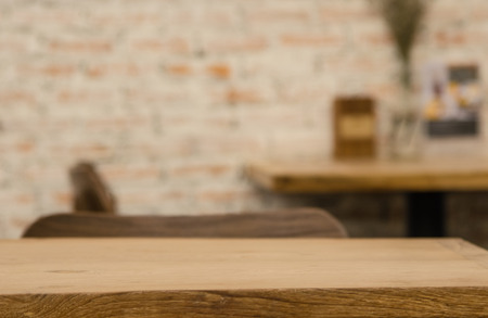 Empty areas on wooden floors and floors, restaurants or cafes are blurred for use in product presentation.の写真素材