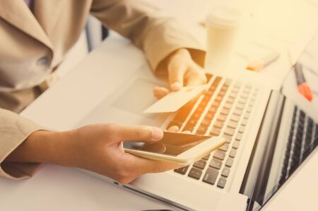Credit Card Holders Used Laptops and smartphone Ordering and Payment - Concepts of Using Technology in Businessの写真素材