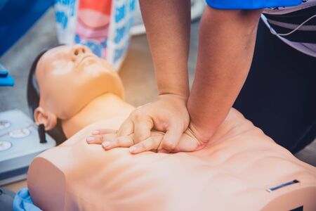 Demonstration of CPR with rubber puppets is a teaching method to press the chest to teach life saving in emergency.の写真素材