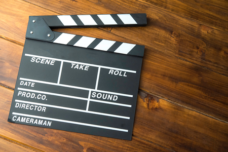 Slate for cut film placed on wooden floor.の写真素材