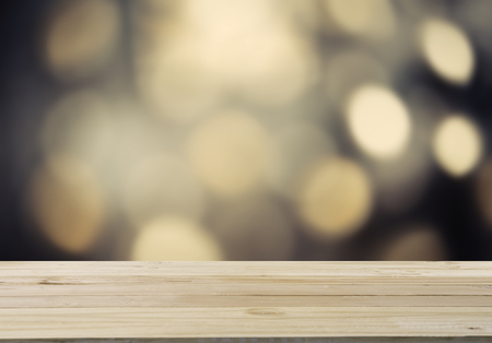 The plank was laid for product show. And there is bokeh light blur into the backgroundの写真素材